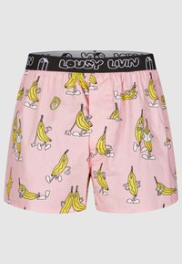 Pink boxers featuring a pattern of yellow bananas with cartoon faces, black waistband with "LOUSY LIVIN" text, cotton material.