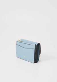 Light blue leather wallet with a zippered compartment, stitched detailing, and a gold logo. Compact design with curved front pocket.
