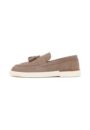 Taupe suede loafer with tassels and white rubber sole, side view, casual slip-on men's shoe.