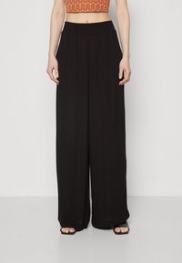 Black wide-leg trousers with an elastic waistband, made of lightweight fabric, featuring a smooth texture and full-length design.