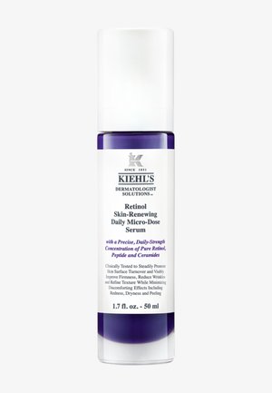 Bouteille de sérum violette et blanche avec un distributeur à pompe, dotée d'une étiquette décrivant ses propriétés en rétinol, 1,7 fl. oz. (50 ml).