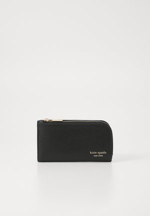 Black zippered wallet in textured material with gold hardware. Features embossed logo on the front and a rounded shape.