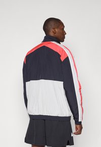Under Armour ICON TRACK - Training jacket - white/black