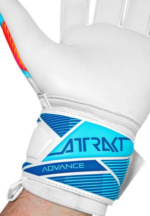 White goalkeeper glove with blue accents and the words "ATRAKT" and "ADVANCE" worn on a raised hand.