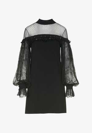 Vestido negro con mangas abullonadas de encaje transparente, texturizado con un patrón de puntos y con volantes alrededor del escote y los puños.