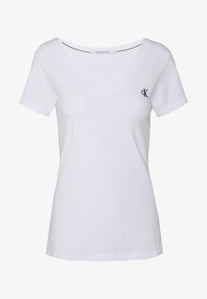 White cotton t-shirt with short sleeves, v-neck design, featuring a small navy logo on the left chest and a straight hem.