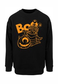 Fekete pulóver narancssárga grafikai mintával, amely egy mesefigurát, tököt és "Boo" szöveget ábrázol. Pamut anyag ribbelt mandzsettákkal.