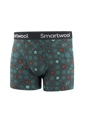 Herenboxers met een groene basis en een circulair bloemmotief in zwart, rood en lichtblauw, voorzien van een zwarte tailleband met het "Smartwool"-logo.