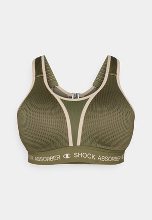 Olijfgroene sportbeha met een textuur, beige accenten, brede bandjes en een logoband onderaan. Ritssluiting aan de achterkant.