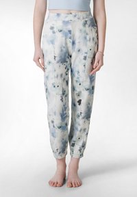 Loose-fitting pants in a light fabric, featuring a blue and white floral pattern, elasticized cuffs, and a high waistband with central pleats.