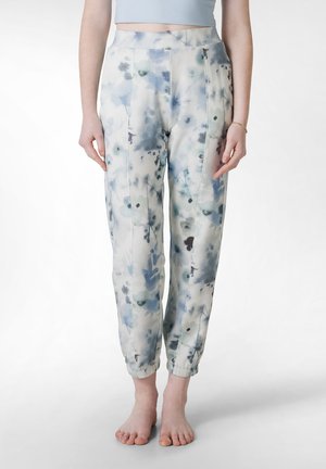 Pantaloni larghi in un tessuto leggero, caratterizzati da un motivo floreale blu e bianco, polsini elasticizzati e una vita alta con pieghe centrali.