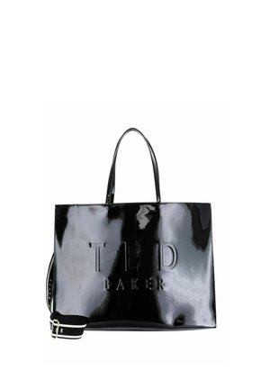 Sac cabas noir brillant Ted Baker avec deux poignées et une bandoulière noire et blanche amovible, logo embossé sur le devant.