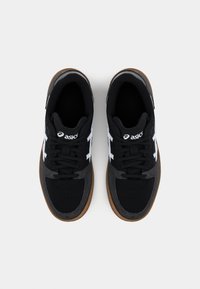 Black and gray athletic shoes with a textured finish, white logo, and laces; gum rubber sole; padded collar. Top view.