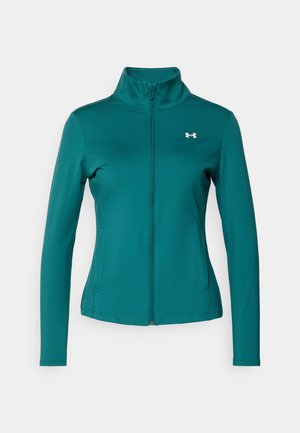 Blågrön zip-up-jacka med långa ärmar, med hög krage och en liten vit logotyp på vänster bröst. Slät textur och figursydd design.