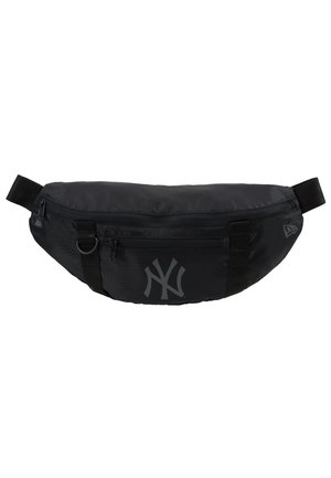 Black nylon fanny pack with a smooth texture, featuring a large grey New York Yankees logo and adjustable straps for secure wear.