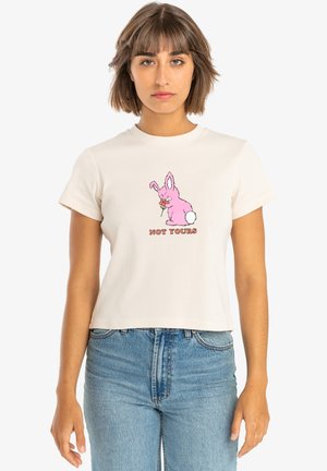 Cropped white cotton t-shirt featuring a pink cartoon bunny with a carrot and the text "NOT YOURS" in red. Simple design, short sleeves.