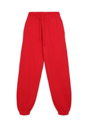 Pantalons de survêtement rouges avec une taille élastique et un cordon de serrage, présentant des poignets fuselés. Fabriqués en tissu doux et léger.