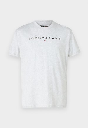 Világosszürke pamut póló, kerek nyakkal, rövid ujjú, amelyen fekete felirat szerepel "TOMMYJEANS" az elején.