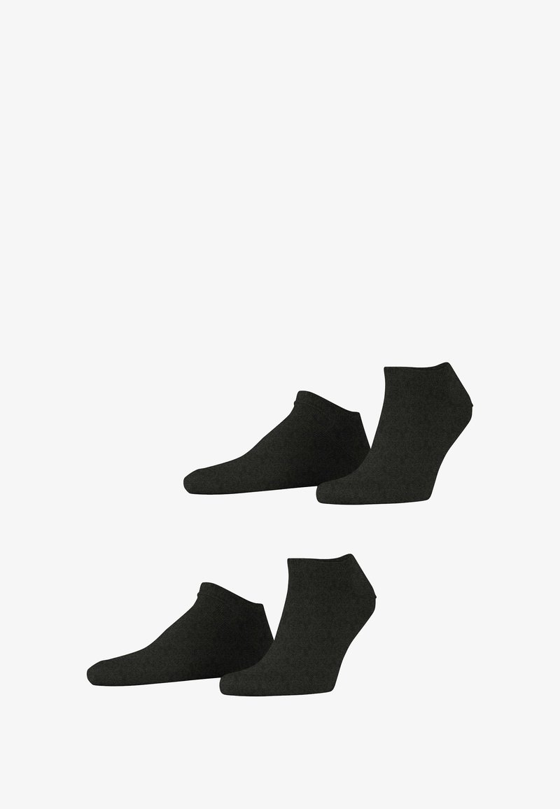 Chaussettes noires à la cheville en tissu texturé. Le design présente une coupe basse, avec des bords lisses et sans logos ni motifs visibles.