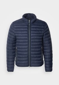 Giacca imbottita blu navy con colletto rialzato, chiusura a zip frontale, imbottitura orizzontale e tasche laterali con zip. Il materiale sembra leggero e liscio.