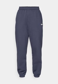 STUDIO SWEATPANTS - Tracksuit bottoms - odyssey gray
