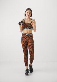 Puma ANIMAL REMIX 7/8 - Leggings - teak