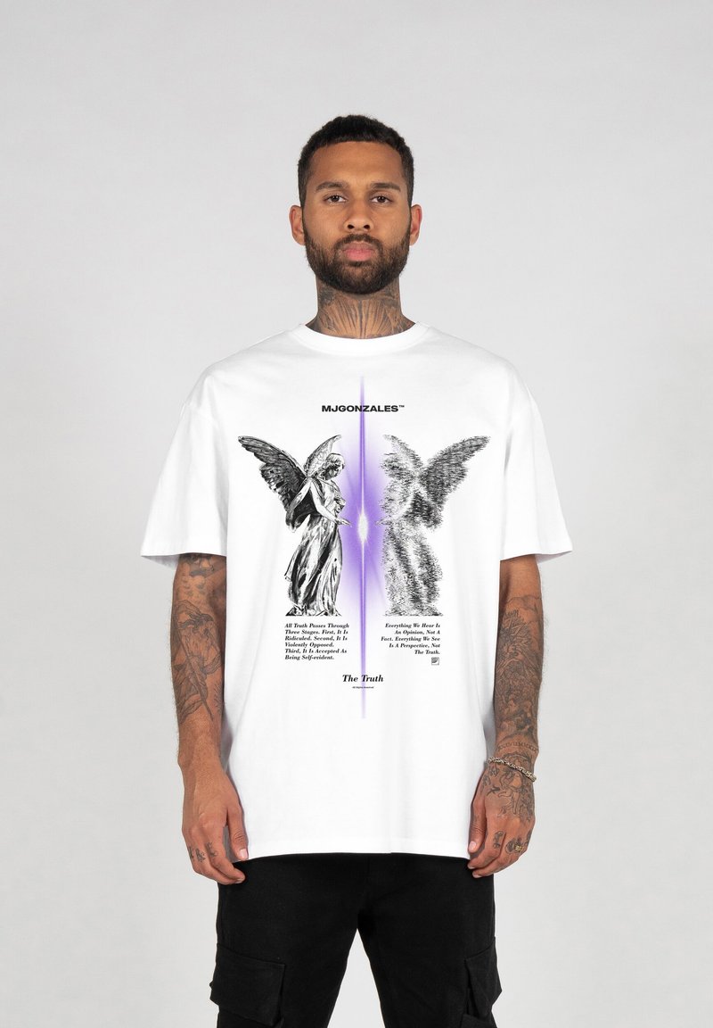 White T-shirt featuring black angel graphics and text. Soft fabric, loose fit, centered design with purple gradient background.