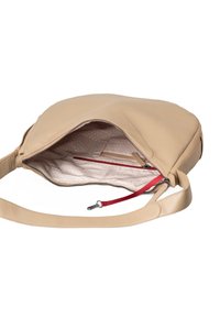 Borsa a tracolla in pelle beige con chiusura zip, rifiniture in zip rossa e fodera con motivo. L'interno offre più scomparti per l'organizzazione.