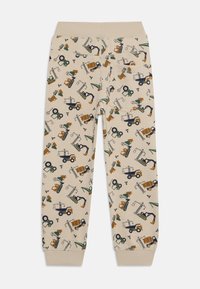 Beige Jogginghosen mit verschiedenen kleinen, bunten Mustern von Baumaschinen. Mit elastischem Bund und strukturiertem Stoff.