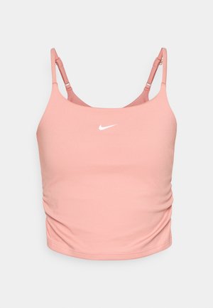 Rózsaszín sportmelltartó, amely puha anyagból készült, vékony állítható pántokkal és egy fehér Nike logóval az elején. Finom ráncolás az oldalán.