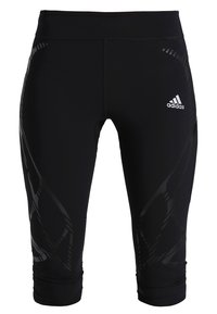 Zwarte Adidas sportleggings met driedelige lengte en subtiele reflecterende patronen op de bovenbenen, Adidas-logo op de bovenkant van het rechterbeen.