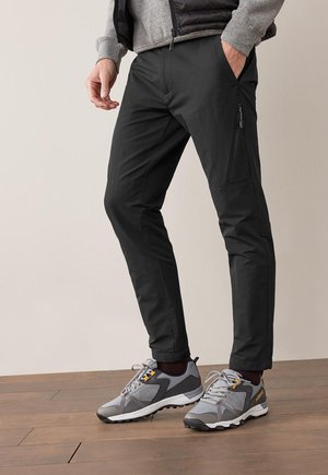 ACTIVE ZIP-OFF CARGO TROUSERS SLIM FIT - Stoffhose - black