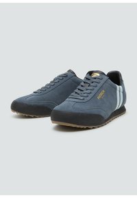Blue suede sneakers featuring a black rubber sole, round toe design, lace-up front, and light blue stripes along the sides. Gold logo accent.
