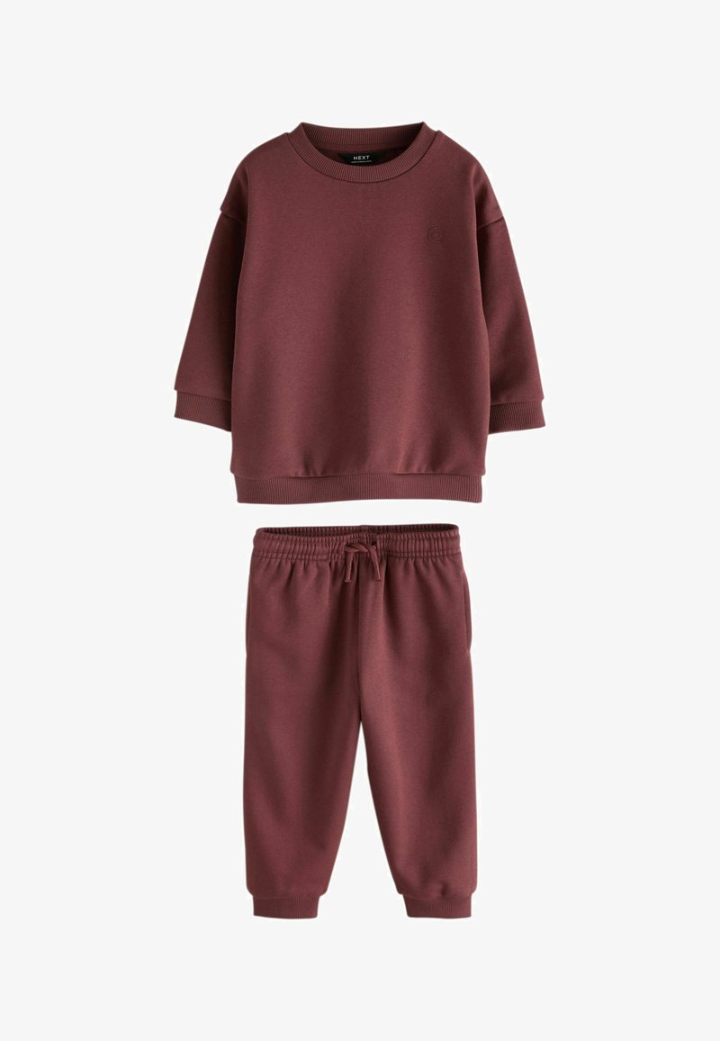 Pull maroon à manches longues avec poignets côtelés et pantalon de jogging assorti avec taille élastique et cordon de serrage.