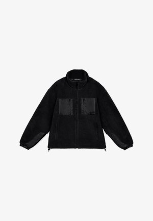 Black fleece jacket with a high collar, featuring black satin front pockets and sleeves. Includes elastic cuffs and adjustable hem.
