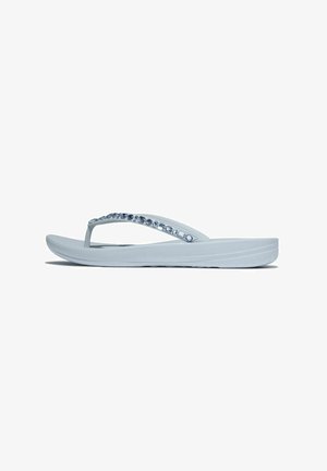 Light blue flip-flop made of rubber with a textured sole, featuring a strap adorned with clear rhinestones along the upper side.
