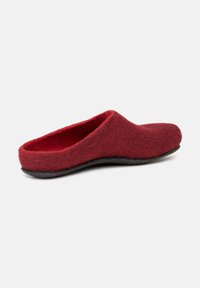 Red wool felt slipper with a rounded toe and backless design. Features a textured upper and a black rubber sole for grip.