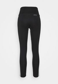 Leggings neri con vita alta, realizzati in materiale elasticizzato. Presentano strisce laterali bianche e un logo sulla vita posteriore.