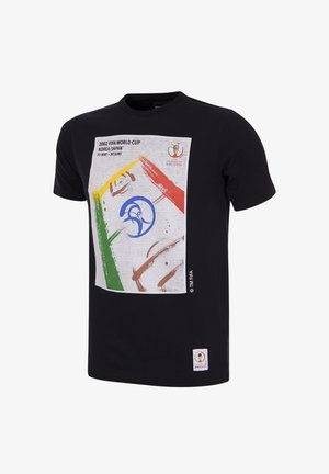 Zwarte katoenen T-shirt met een grafische print met de tekst "2002 FIFA Wereldkampioenschap Korea/Japan" en kleurrijke verfstrepen in geel, groen en rood.