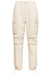 Beige cargo bukser med elastisk talje, flere sidelommer og snore i ankelen. Lavet af letvægtsstof med en glat tekstur.