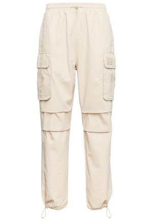 Karl Kani RUBBER SIGNATURE PANTS UNISEX - Cargo trousers - beige