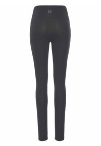 Black leggings with a wide waistband, smooth texture, and form-fitting design. Features a small logo at the back waist.
