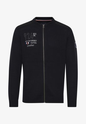 Mørkeblå zip-up cardigan med ribbestrikkede mansjetter og kant, med broderte tall og tekst på brystet og en glatt tekstur.