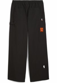 Black cargo pants with an elastic waistband, featuring multiple pockets, an orange label, and a small white graphic detail.