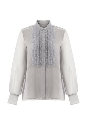 Hellgraue Bluse mit durchscheinenden langen Ärmeln, einer voluminösen Frontpartie und verziertem Muster entlang der Mitte. Knopfverschluss am Kragen.