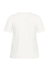 Haut blanc à manches courtes avec un col rond, présentant une texture côtelée subtile et une coupe ample. Design épuré et simple sans motifs visibles.