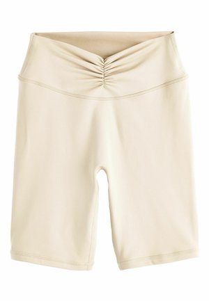 Beige Biker-Shorts mit hoher Taille und gerafftem Detail am Bund, aus glattem Stretchstoff gefertigt.
