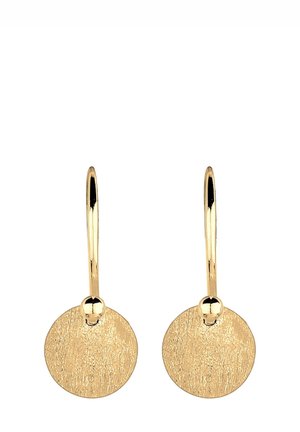 Boucles d'oreilles pendantes en or avec des disques circulaires texturés suspendus à des crochets lisses incurvés, présentées sur un fond blanc.