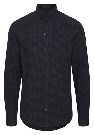 Hosszú ujjú gombos ing sötétkék kockás mintázattal, elől zsebbel és klasszikus gallérral. Az anyag sima és textúrált hatású.