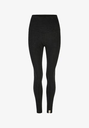 Schwarze Leggings mit hohem Bund, aus elastischem Material, mit einer glatten Oberfläche und einem kleinen Logo-Label am Knöchel.